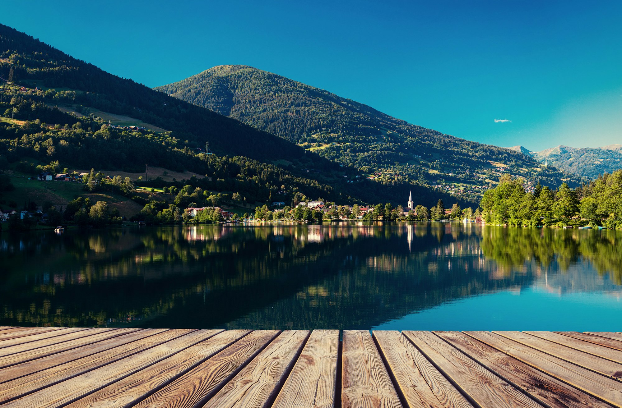 Mountain lake between by mountains. Seaside villa. Italy