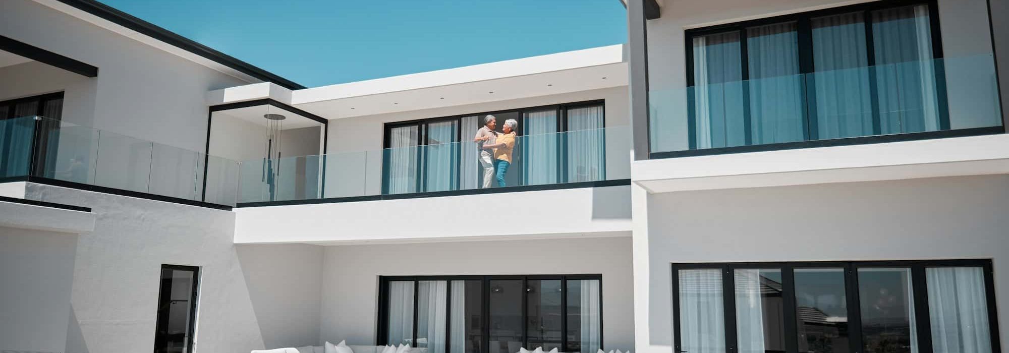 Senior couple in luxury home, house or real estate property while happy, bond and satisfied with we